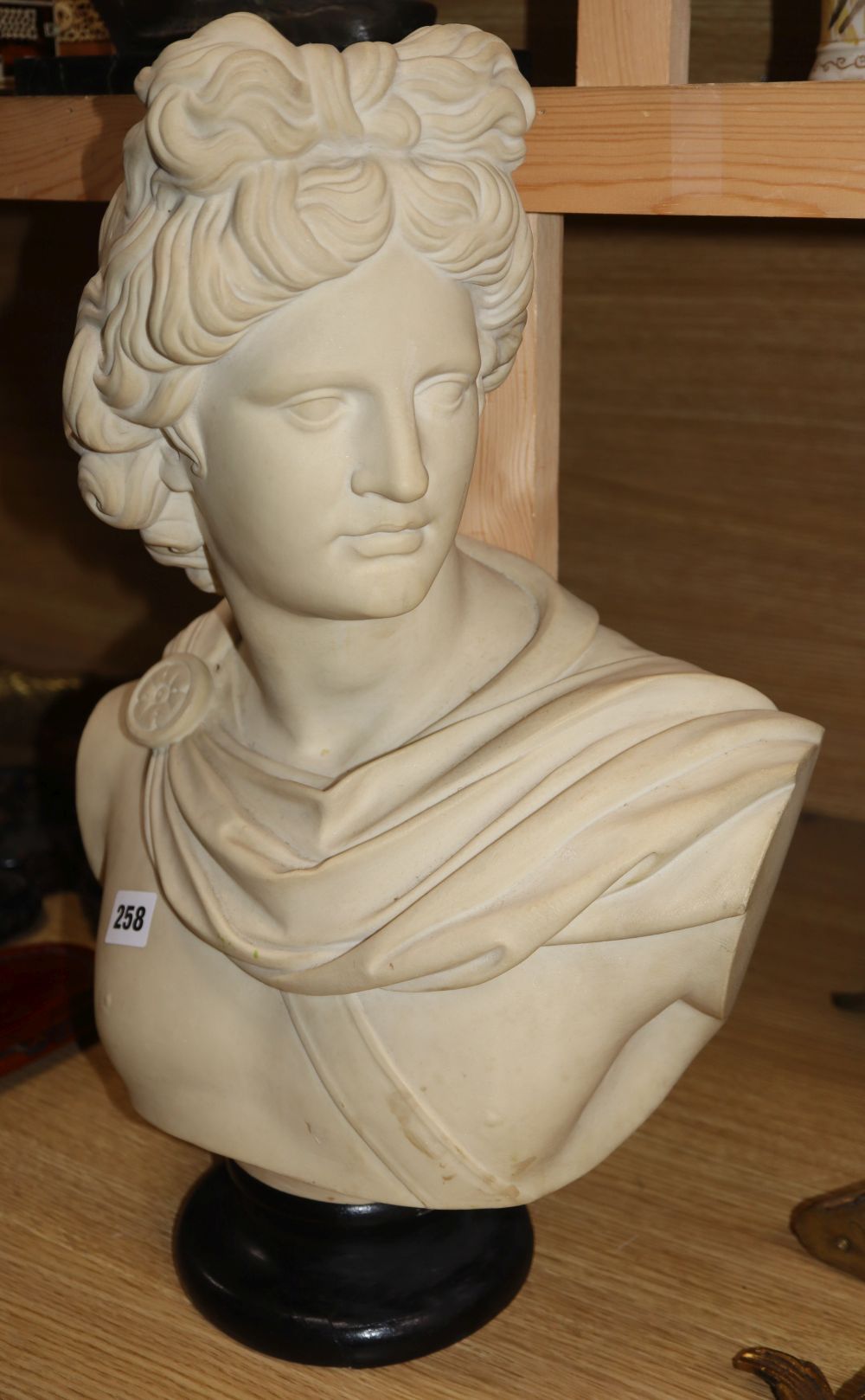 A composition bust of Apollo, marked 912 to the reverse, height 49cm